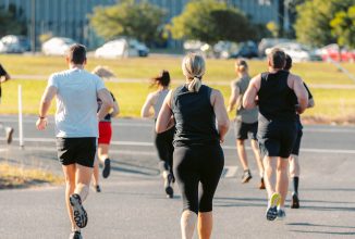 CrossFit trainers running in a group outdoors